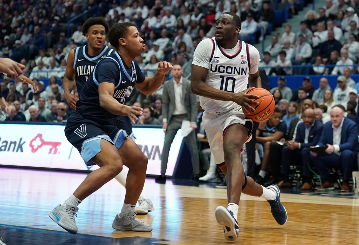 Feb 18, 2025; Hartford, Connecticut, USA; UConn Huskies guard Hassan Diarra (10) drives the ball against Villanova Wildcats guard Jhamir Brickus (2) in the first half at XL Center. Mandatory Credit: David Butler II-Imagn Images