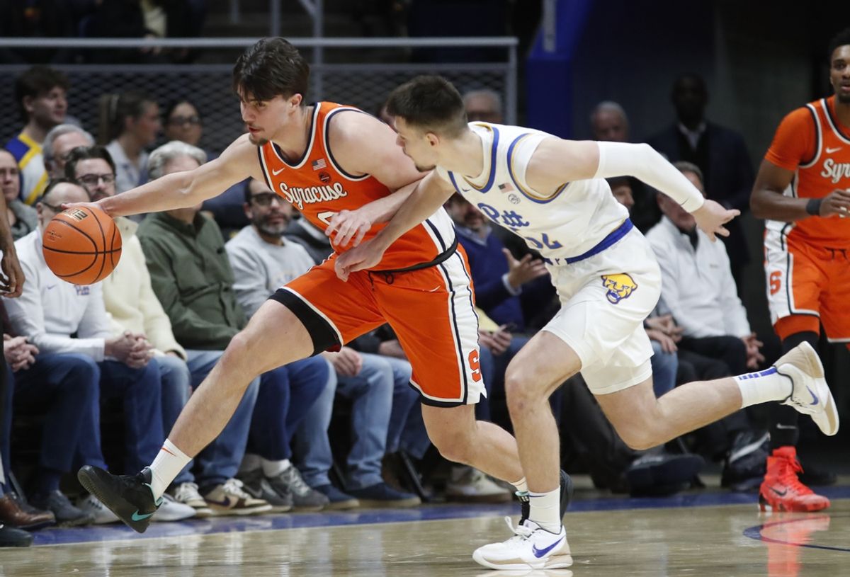 Feb 18, 2025; Pittsburgh, Pennsylvania, USA;  Syracuse Orange guard Jaquan Carlos (5) chases a loose ball against Pittsburgh Panthers guard Amsal Delalic (right) during the first half at the Petersen Events Center. Mandatory Credit: Charles LeClaire-Imagn Images
