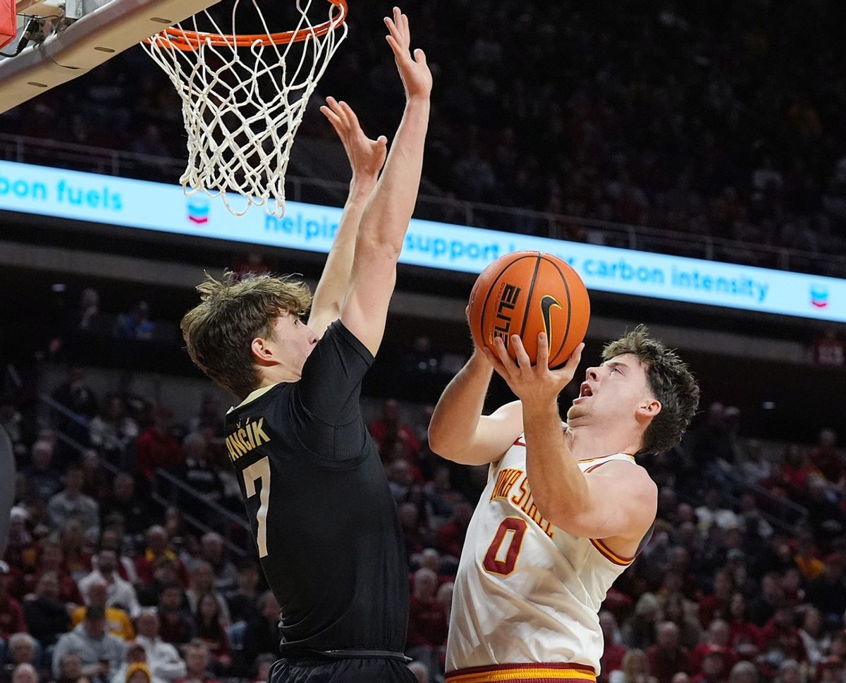 Iowa State Cyclones guard Nate Heise (0) shoots the ball around Colorado Buffaloes forward Sebastian Rancik (7) during the first half in the Big-12 men’s basketball at Hilton Coliseum on Feb.18, 2025 in Ames, Iowa.