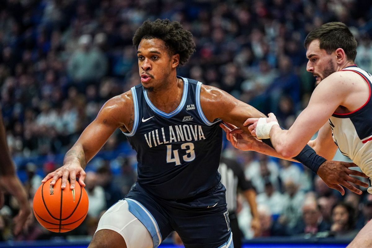 Feb 18, 2025; Hartford, Connecticut, USA; Villanova Wildcats forward Eric Dixon (43) drives the ball against UConn Huskies forward Alex Karaban (11) in the second half at XL Center. Mandatory Credit: David Butler II-Imagn Images