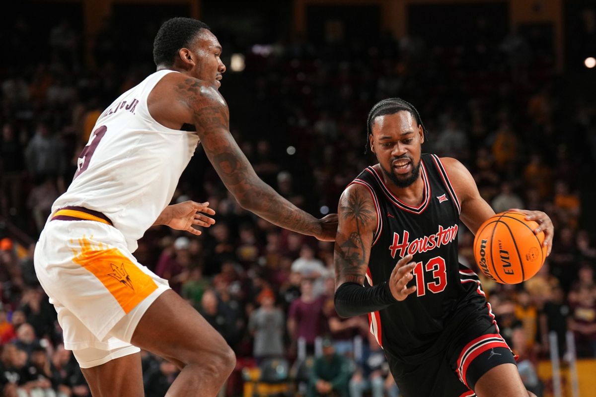 Feb 18, 2025; Tempe, Arizona, USA; Houston Cougars forward J'Wan Roberts (13) drives against Arizona State Sun Devils center Shawn Phillips Jr. (9) during the first half at Desert Financial Arena. Mandatory Credit: Joe Camporeale-Imagn Images