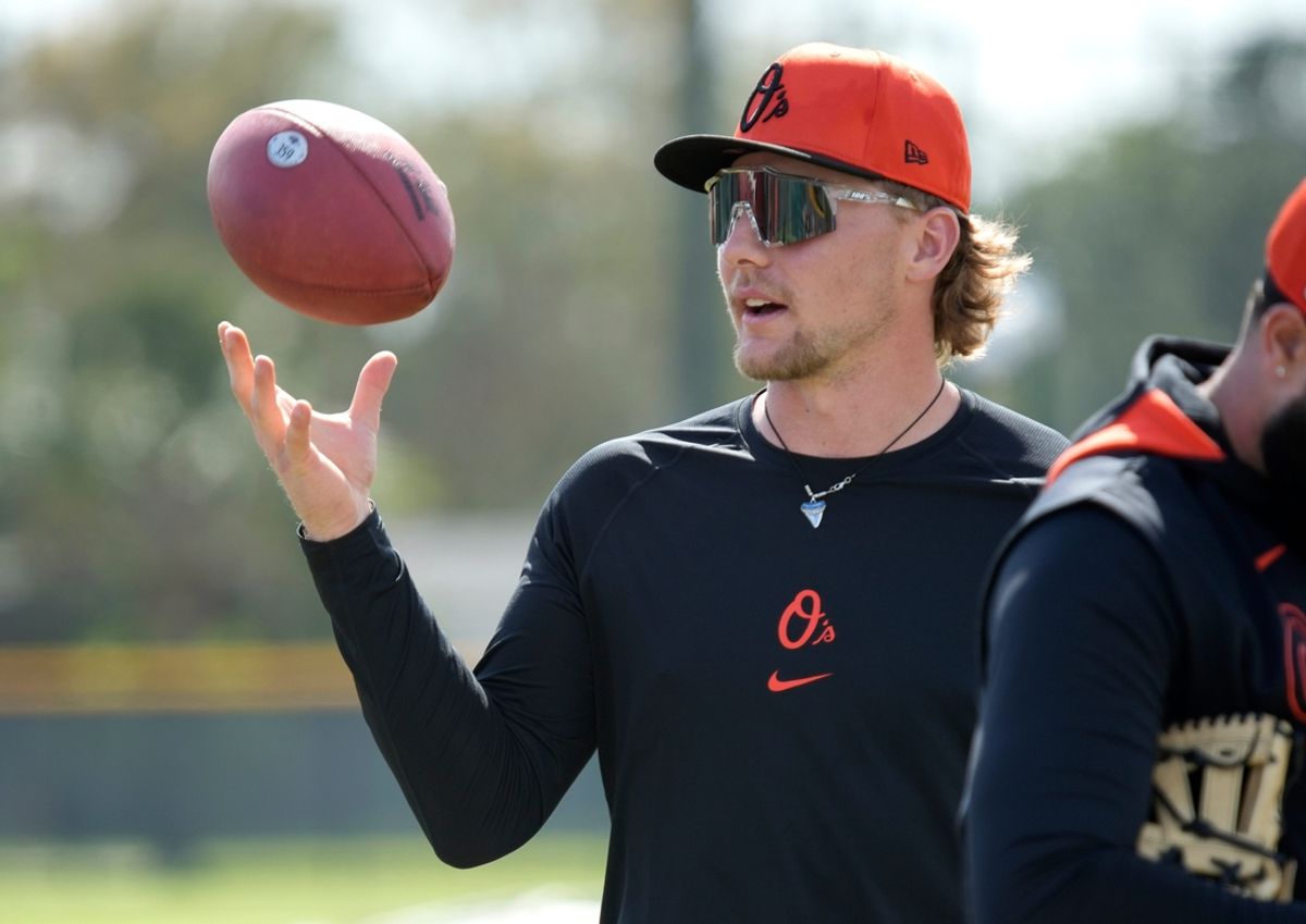 Orioles infielder Gunnar Henderson tosses a football around with teammates on Monday. The Baltimore Orioles held their first full-squad workout of the 2025 spring training season on Monday, Feb. 18th in Sarasota, Florida.