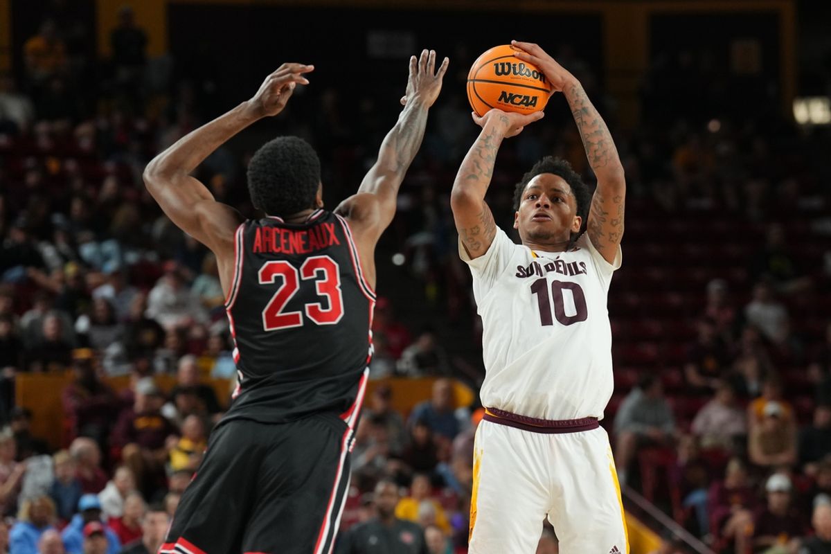 Feb 18, 2025; Tempe, Arizona, USA; Arizona State Sun Devils guard BJ Freeman (10) shoots over Houston Cougars guard Terrance Arceneaux (23) during the second half at Desert Financial Arena. Mandatory Credit: Joe Camporeale-Imagn Images