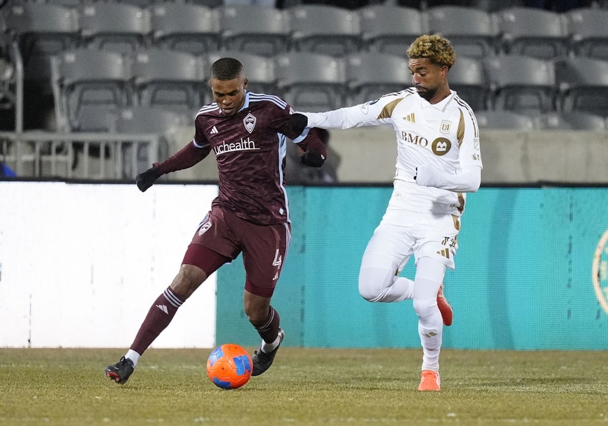 Feb 18, 2025; Commerce City, Colorado, USA; Los Angeles FC midfielder Timothy Tillman (11) defends Colorado Rapids defender Reggie Cannon (4) in the first half at Dick's Sporting Goods Park. Mandatory Credit: Ron Chenoy-Imagn Images