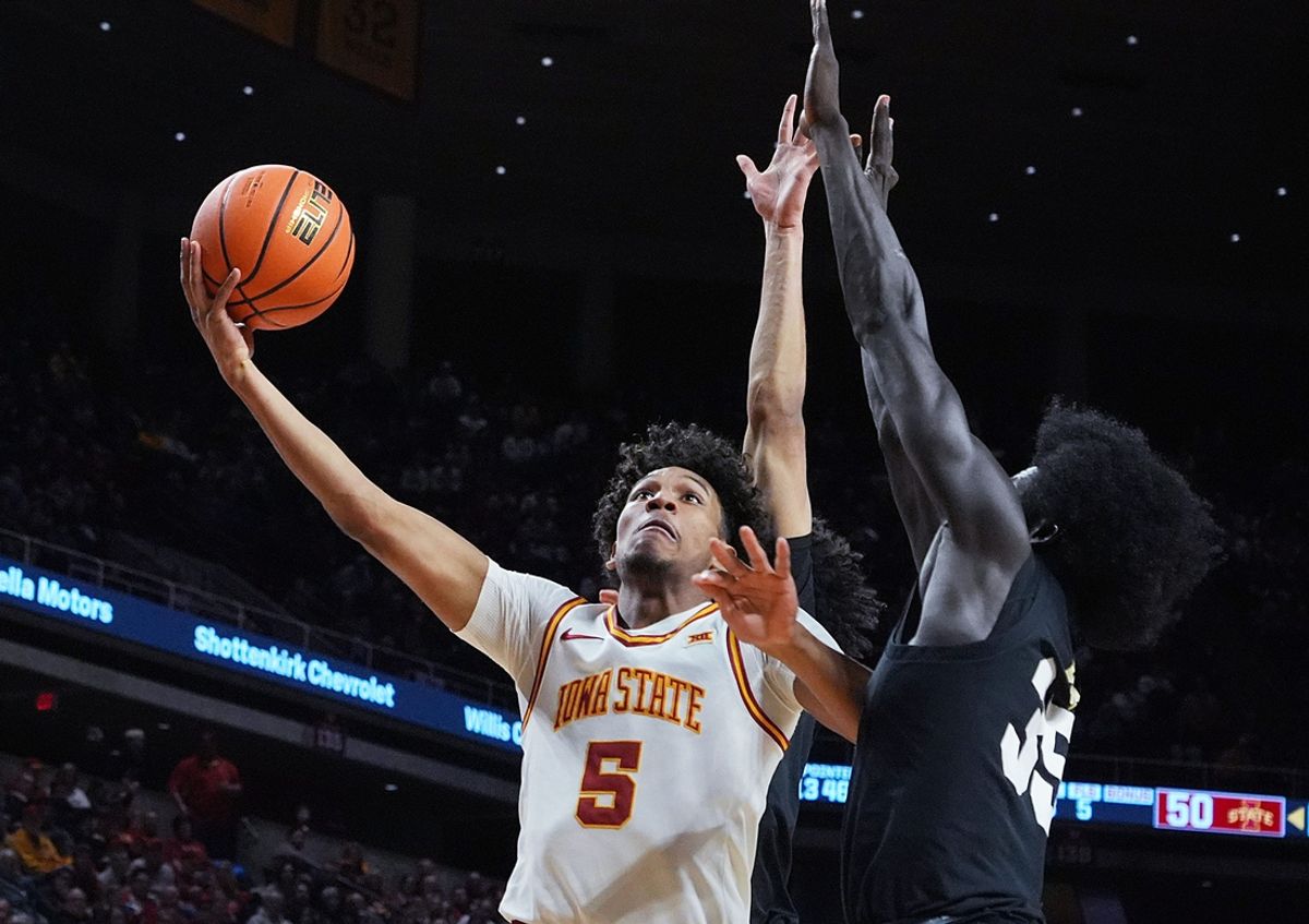 Iowa State Cyclones guard Curtis Jones (5) goes for a layup around Colorado Buffaloes forward Assane Diop (35) during the second half in the Big-12 men’s basketball at Hilton Coliseum on Feb.18, 2025 in Ames, Iowa.
