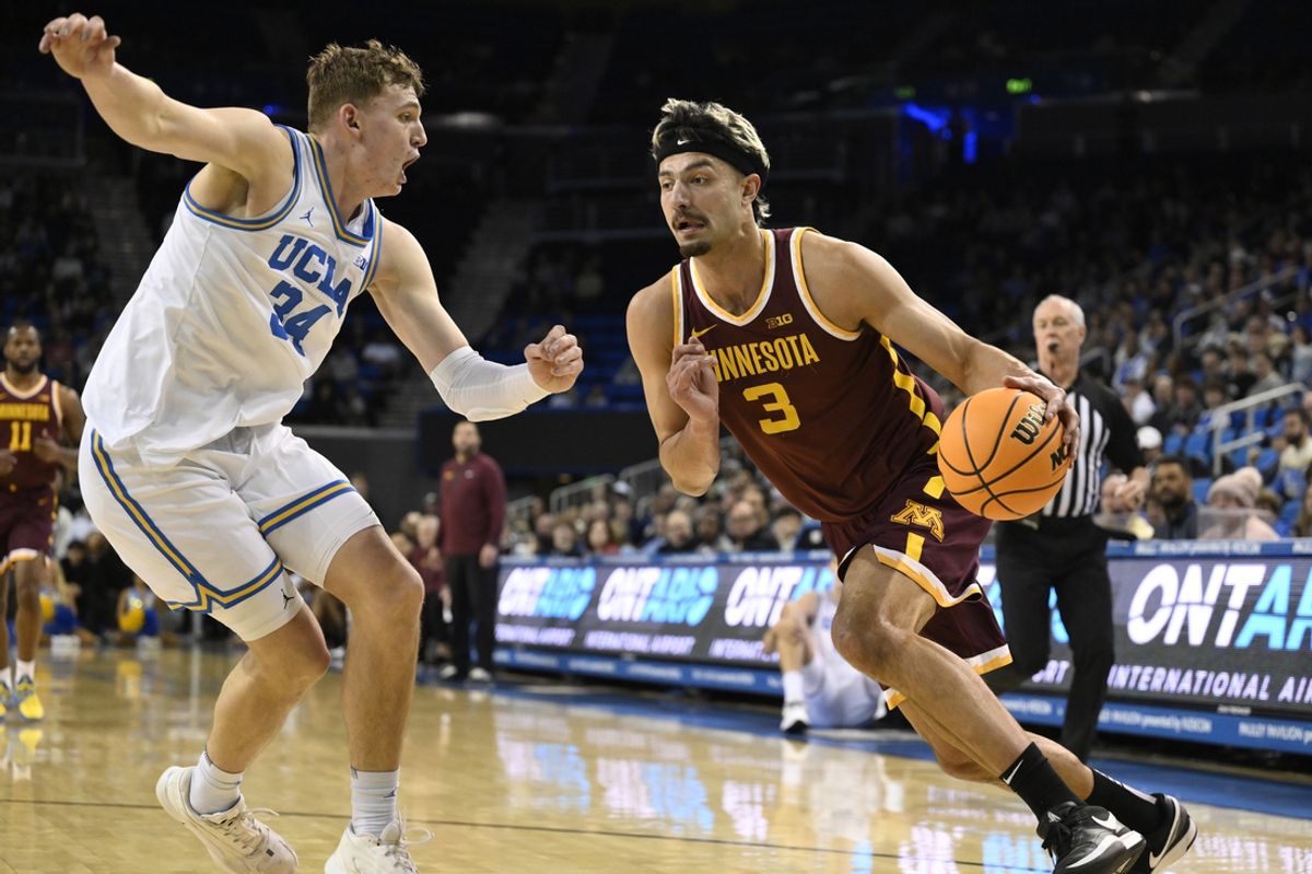 Feb 18, 2025; Los Angeles, California, USA; Minnesota Golden Gophers forward Dawson Garcia (3) drives against UCLA Bruins forward Tyler Bilodeau (34) during the first half at Pauley Pavilion presented by Wescom. Mandatory Credit: Robert Hanashiro-Imagn Images