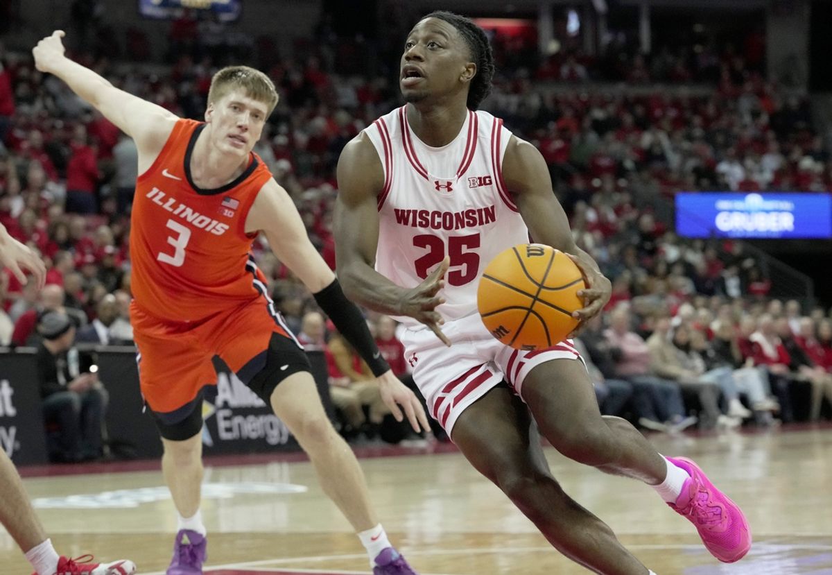 Wisconsin guard John Blackwell (25) drives past Illinois forward Ben Humrichous (3) during the second half of their game Tuesday, February 18, 2025 at the Kohl Center in Madison, Wisconsin. Wisconsin beat Illinois 95-74.