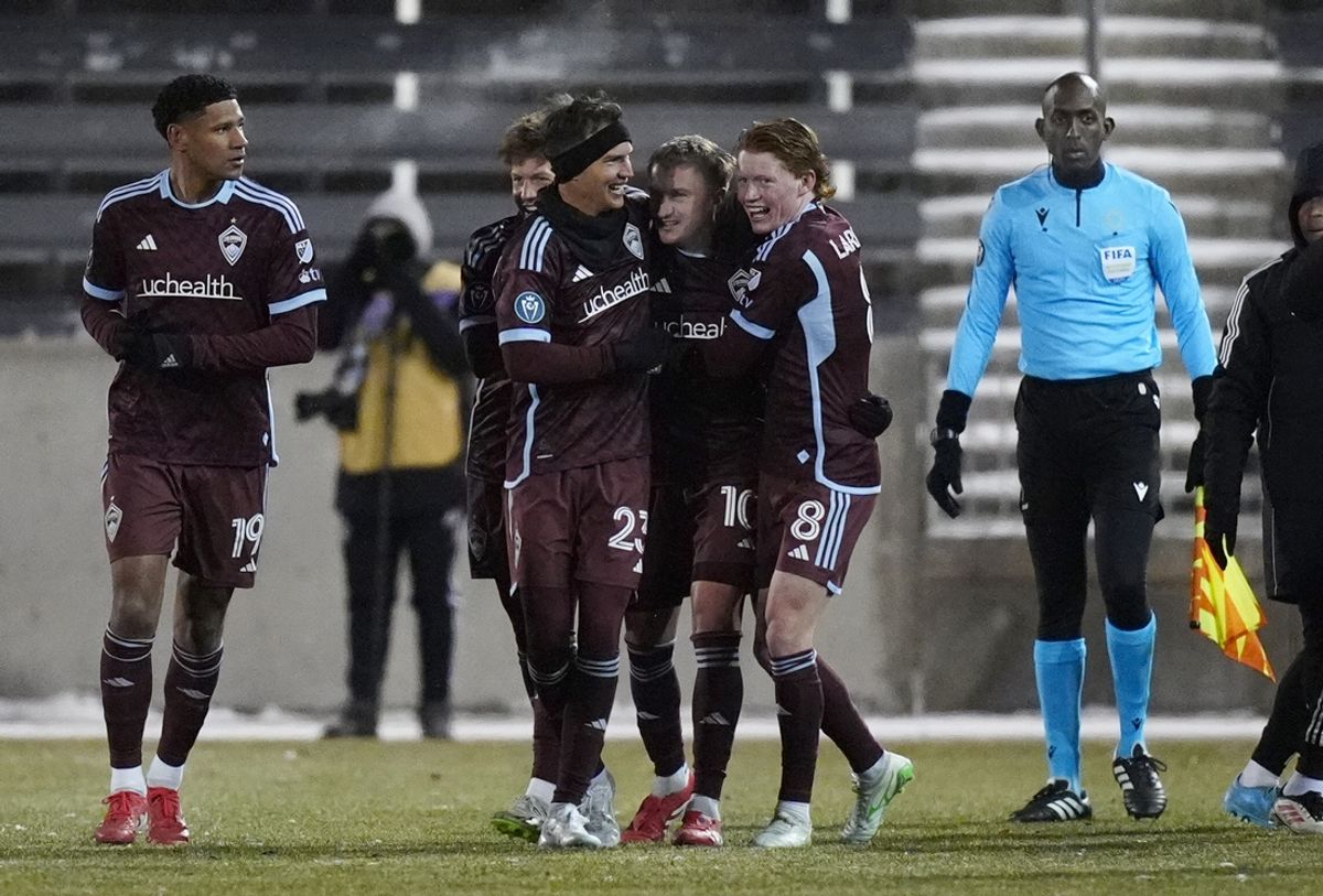 Feb 18, 2025; Commerce City, Colorado, USA; Colorado Rapids midfielder Djordje Mihailovic (10) (center) celebrates his free kick goal with midfielder Cole Bassett (23), midfielder Oliver Larraz (8) and defender Ian Murphy (19) in the second half at Dick's Sporting Goods Park. Mandatory Credit: Ron Chenoy-Imagn Images