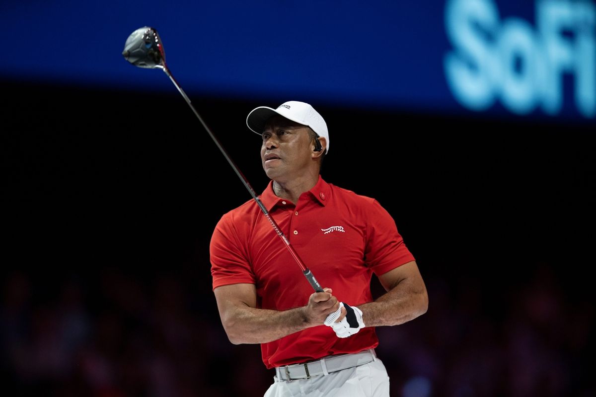 Tiger Woods of Jupiter Links GC watches his tee shot against New York Golf Club during a TGL match in SoFi Center at Palm Beach State College on February 18, 2025, in Palm Beach Gardens, Florida.