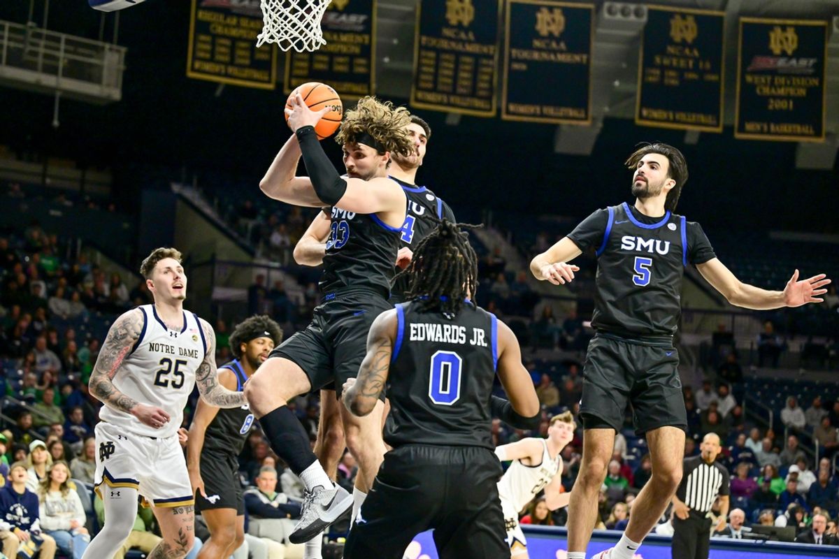 Feb 19, 2025; South Bend, Indiana, USA; SMU Mustangs forward Matt Cross (33) grabs a rebound in the first half against the Notre Dame Fighting Irish at the Purcell Pavilion. Mandatory Credit: Matt Cashore-Imagn Images