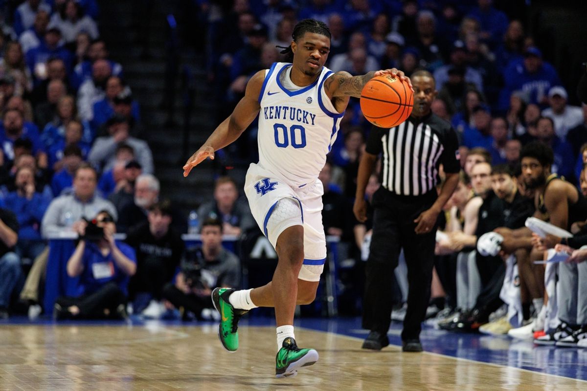 Feb 19, 2025; Lexington, Kentucky, USA; Kentucky Wildcats guard Otega Oweh (00) reaches for the ball during the first half against the Vanderbilt Commodores at Rupp Arena at Central Bank Center. Mandatory Credit: Jordan Prather-Imagn Images