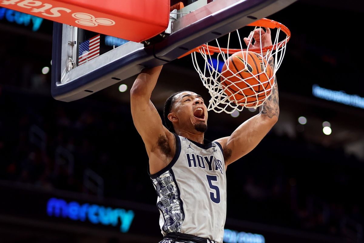Feb 19, 2025; Washington, District of Columbia, USA; Georgetown Hoyas guard Micah Peavy (5) dunks during the first half against the Providence Friars at Capital One Arena. Mandatory Credit: Daniel Kucin Jr.-Imagn Images