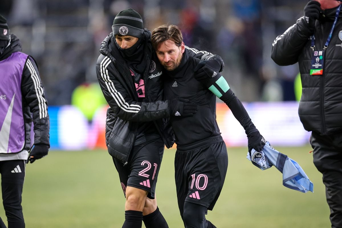 Feb 19, 2025; Kansas City, Kansas, USA; Inter Miami defender Nicolas Freire (21) hugs Inter Miami forward Lionel Messi (10) after the match at Children's Mercy Park. Mandatory Credit: William Purnell-Imagn Images