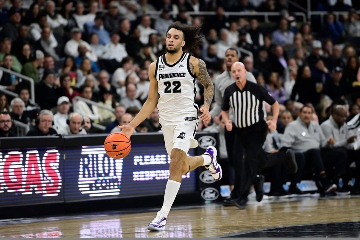 Nov 14, 2023; Providence, Rhode Island, USA; Providence Friars guard Devin Carter (22) drives up the court during the first half against the Wisconsin Badgers at Amica Mutual Pavilion.