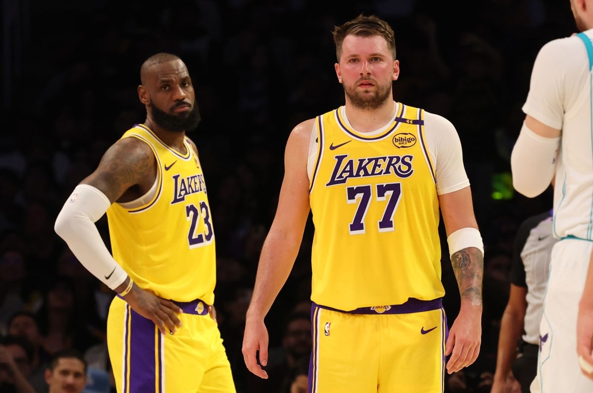 Feb 19, 2025; Los Angeles, California, USA; Los Angeles Lakers forward LeBron James (23) and guard Luka Doncic (77) during the second quarter against the Charlotte Hornets at Crypto.com Arena. Mandatory Credit: Jason Parkhurst-Imagn Images