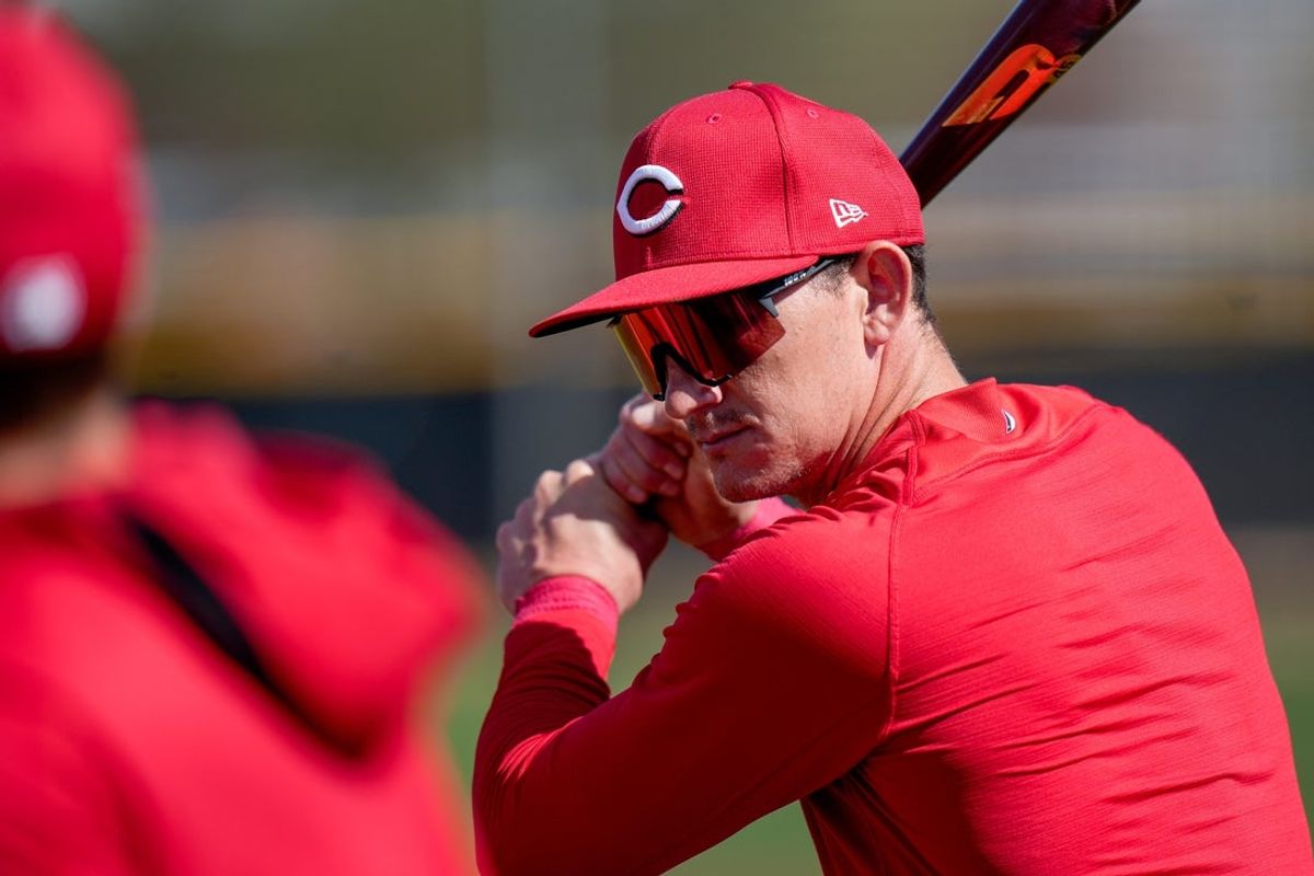 Cincinnati Reds outfielder Austin Hays (12) practices his swing as he waits his turn to bat during spring training, Thursday, Feb. 20, 2025, at the Cincinnati Reds Player Development Complex in Goodyear, Ariz.