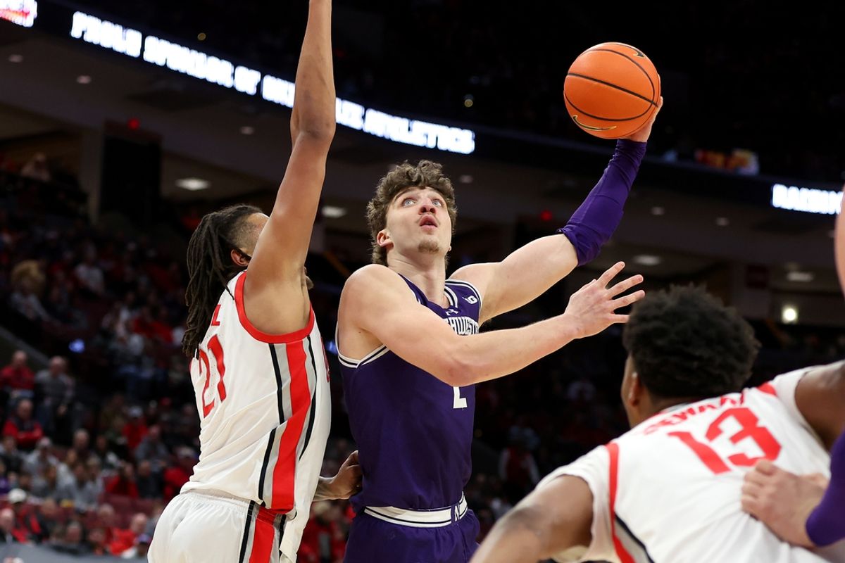 Feb 20, 2025; Columbus, Ohio, USA; Northwestern Wildcats forward Nick Martinelli (2) shoots the ball over Ohio State Buckeyes forward Devin Royal (21) during the first half at Value City Arena. Mandatory Credit: Joseph Maiorana-Imagn Images