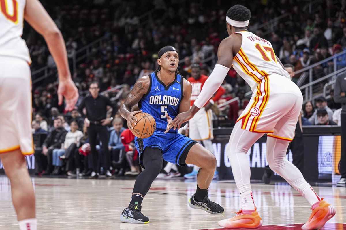 Feb 20, 2025; Atlanta, Georgia, USA; Orlando Magic forward Paolo Banchero (5) pulls up to shoot against Atlanta Hawks forward Onyeka Okongwu (17) during the first half at State Farm Arena. Mandatory Credit: Dale Zanine-Imagn Images