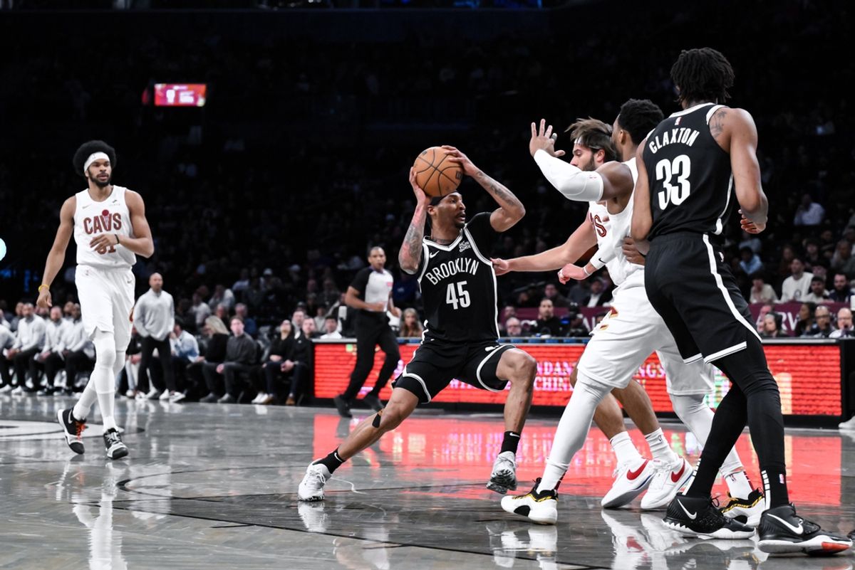 Feb 20, 2025; Brooklyn, New York, USA; Brooklyn Nets guard Keon Johnson (45) drives to the basket while being defended by Cleveland Cavaliers guard Max Strus (1) during the first half at Barclays Center. Mandatory Credit: John Jones-Imagn Images