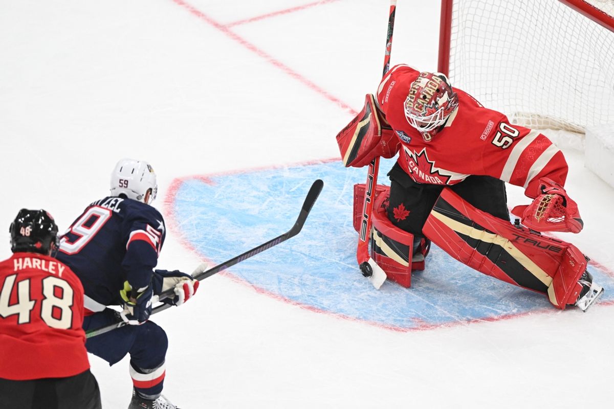 Feb 20, 2025; Boston, MA, USA; [Imagn Images direct customers only]  Team Canada goaltender Jordan Binnington (50) blocks a shot by Team USA forward Jake Guentzel (59) during the third period during the 4 Nations Face-Off ice hockey championship game at TD Garden. Mandatory Credit: Brian Fluharty-Imagn Images