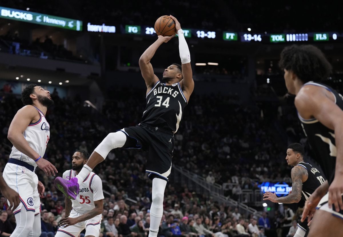 Feb 20, 2025; Milwaukee, Wisconsin, USA; Milwaukee Bucks forward Giannis Antetokounmpo (34) puts up a shot against LA Clippers guard Ben Simmons (25) in the second  half at Fiserv Forum. Mandatory Credit: Michael McLoone-Imagn Images