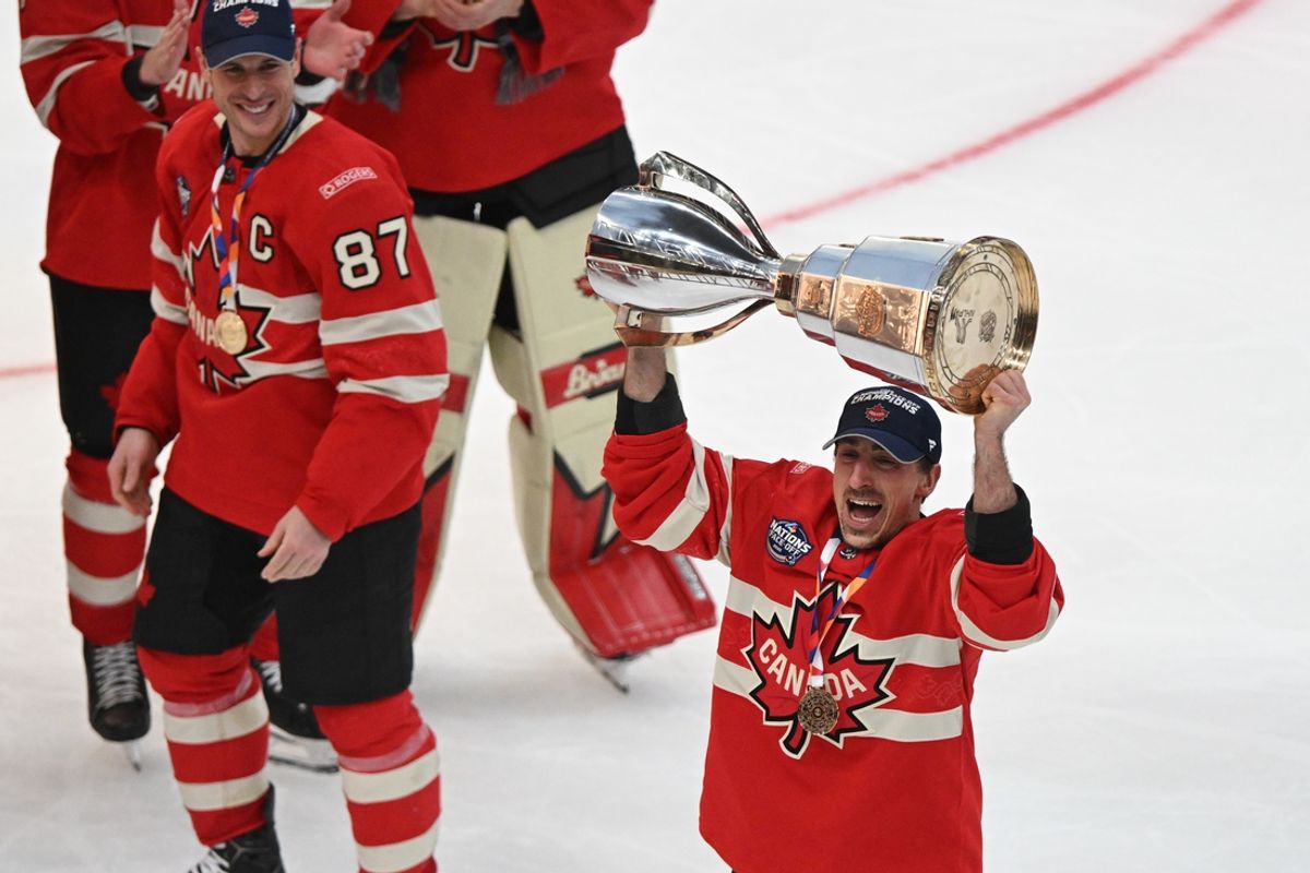 Feb 20, 2025; Boston, MA, USA; [Imagn Images direct customers only]  Team Canada forward Brad Marchand (63) lifts the 4 Nations Face-Off trophy after winning against Team USA in overtime  during the 4 Nations Face-Off ice hockey championship game at TD Garden. Mandatory Credit: Brian Fluharty-Imagn Images