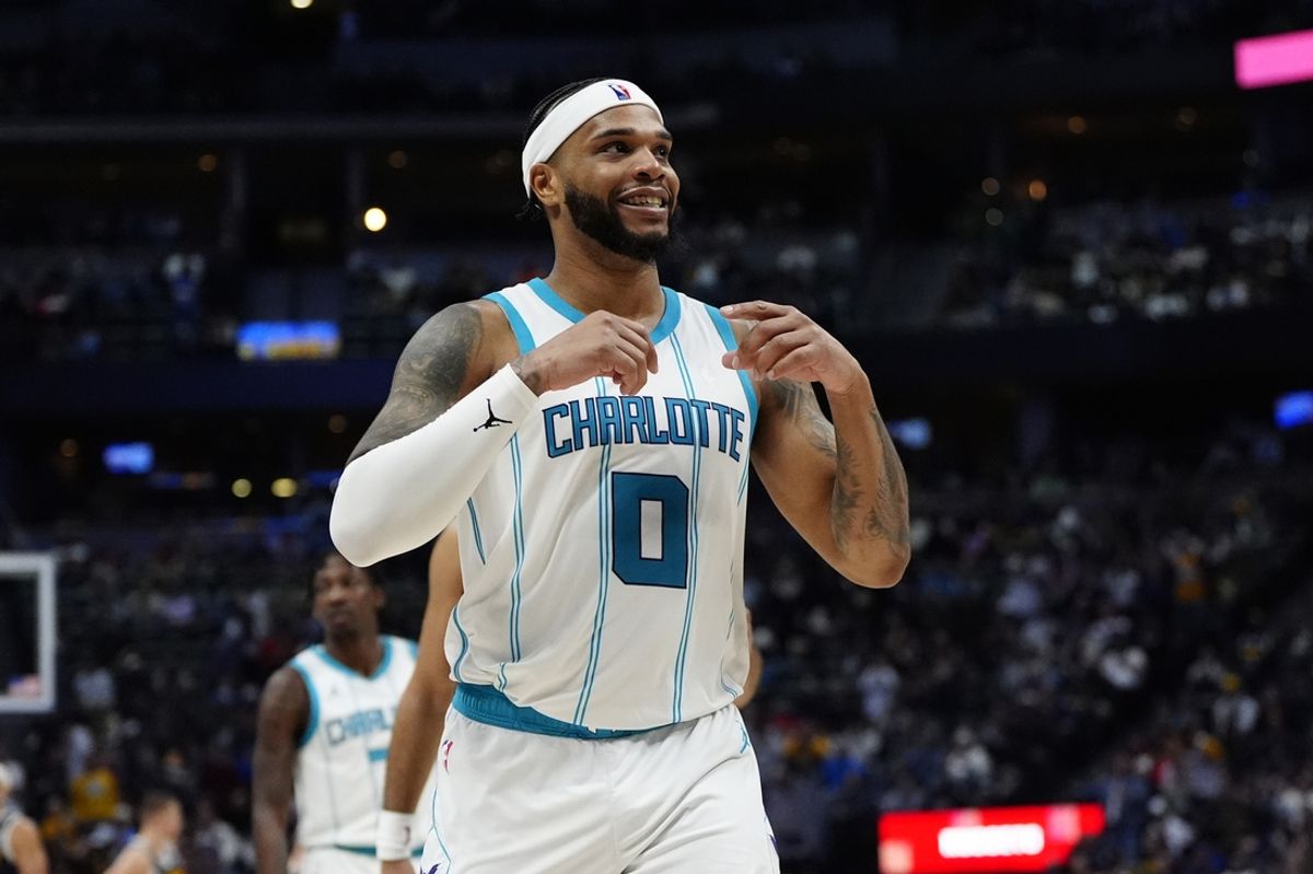 Feb 20, 2025; Denver, Colorado, USA; Charlotte Hornets forward Miles Bridges (0) reacts in the second half against the Denver Nuggets at Ball Arena. Mandatory Credit: Ron Chenoy-Imagn Images