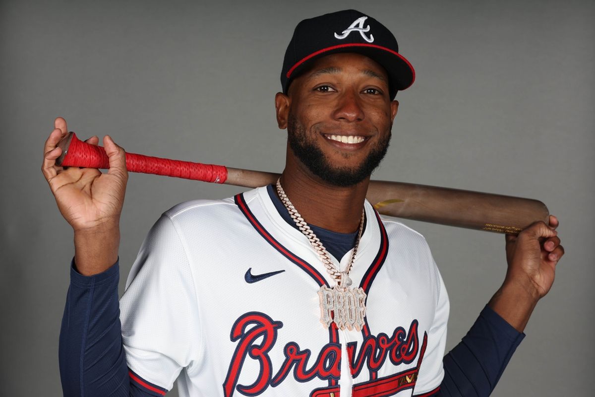 Feb 21, 2025; North Port, FL, USA; Atlanta Braves outfielder Jurickson Profar (7) takes photos during media day CoolToday Park. Mandatory Credit: Kim Klement Neitzel-Imagn Images