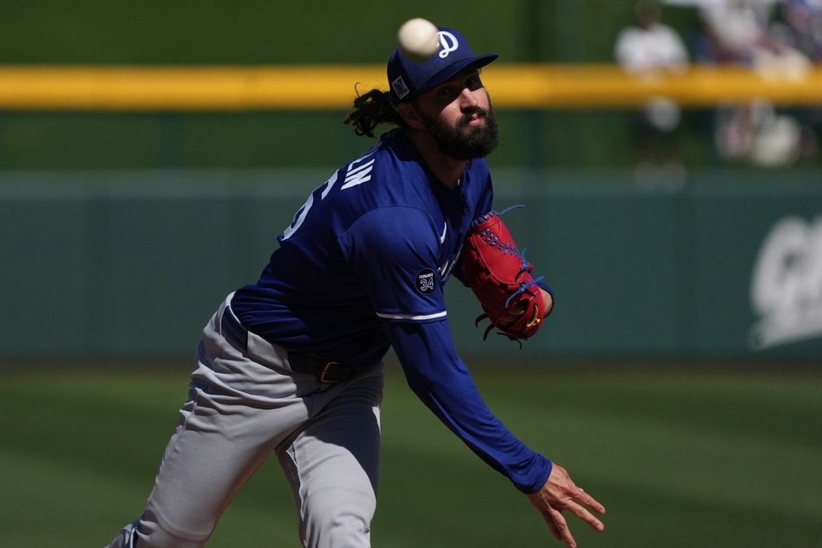 Feb 21, 2025; Mesa, Arizona, USA; Los Angeles Dodgers pitcher Tony Gonsolin (26) warms up during the first inning against the Chicago Cubs at Sloan Park. Mandatory Credit: Rick Scuteri-Imagn Images