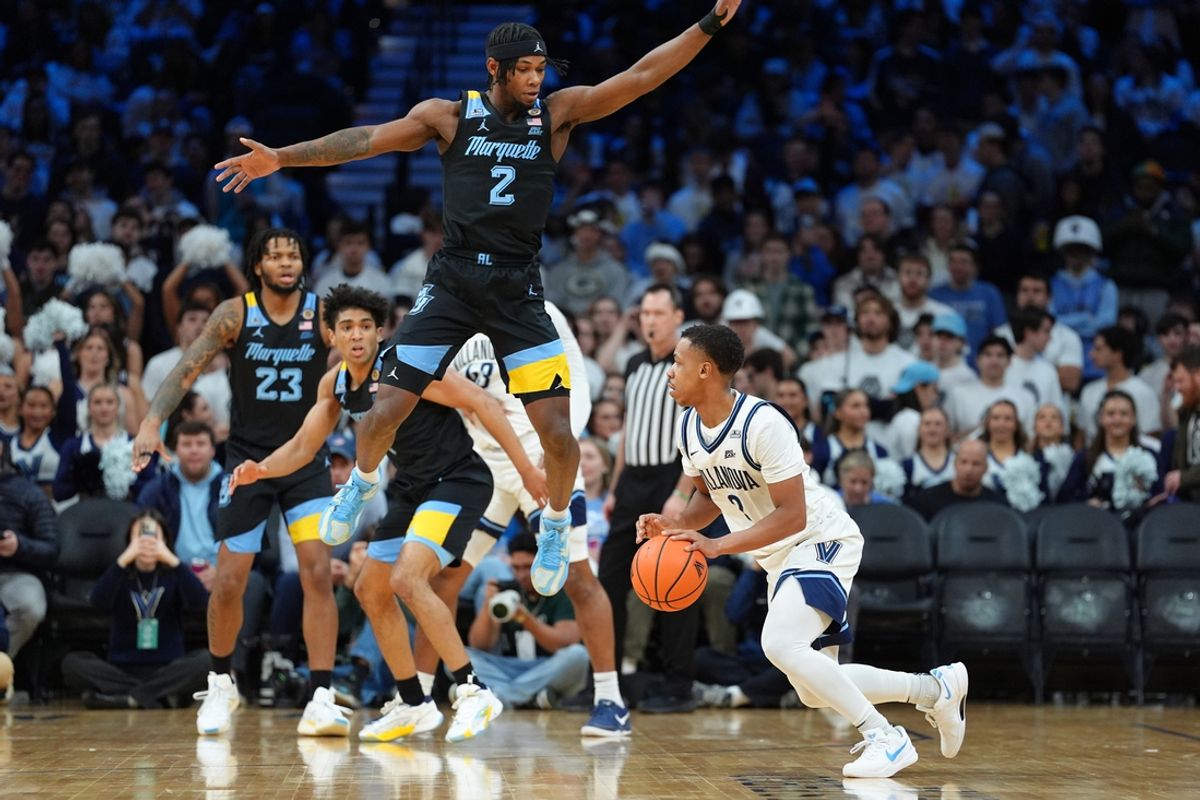 Feb 21, 2025; Philadelphia, Pennsylvania, USA; Villanova Wildcats guard Jhamir Brickus (2) controls the ball against Marquette Golden Eagles guard Chase Ross (2) in the first half at Wells Fargo Center. Mandatory Credit: Kyle Ross-Imagn Images