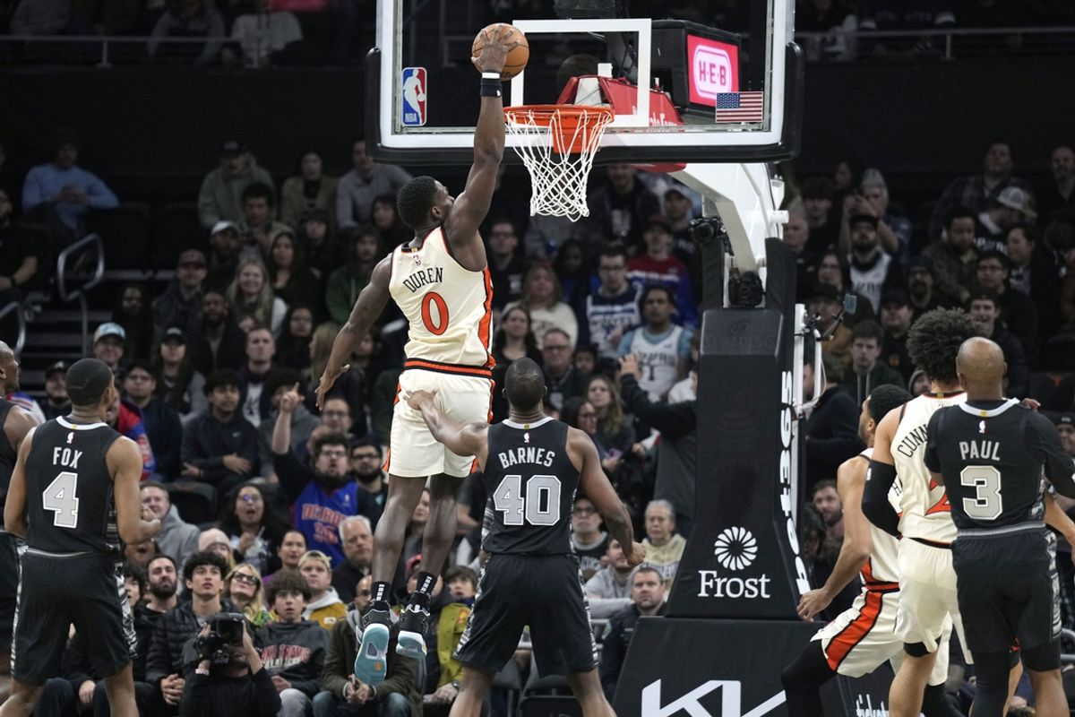 Feb 21, 2025; Austin, Texas, USA; Detroit Pistons center Jalen Duren (0) dunks over San Antonio Spurs forward Harrison Barnes (40) during the first half at Moody Center. Mandatory Credit: Scott Wachter-Imagn Images