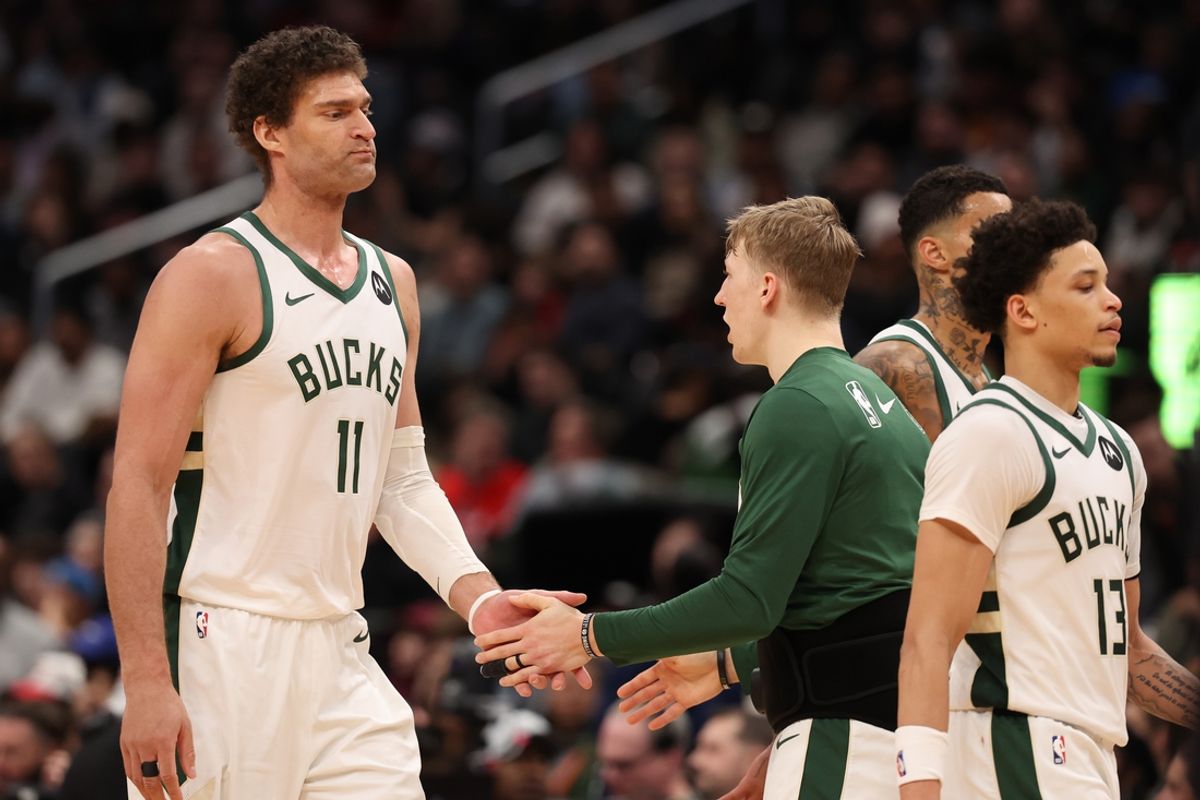Feb 21, 2025; Washington, District of Columbia, USA; Milwaukee Bucks center Brook Lopez (11) is congratulated by teammates after making two free throws in the final minute against the Washington Wizards at Capital One Arena. Mandatory Credit: Geoff Burke-Imagn Images