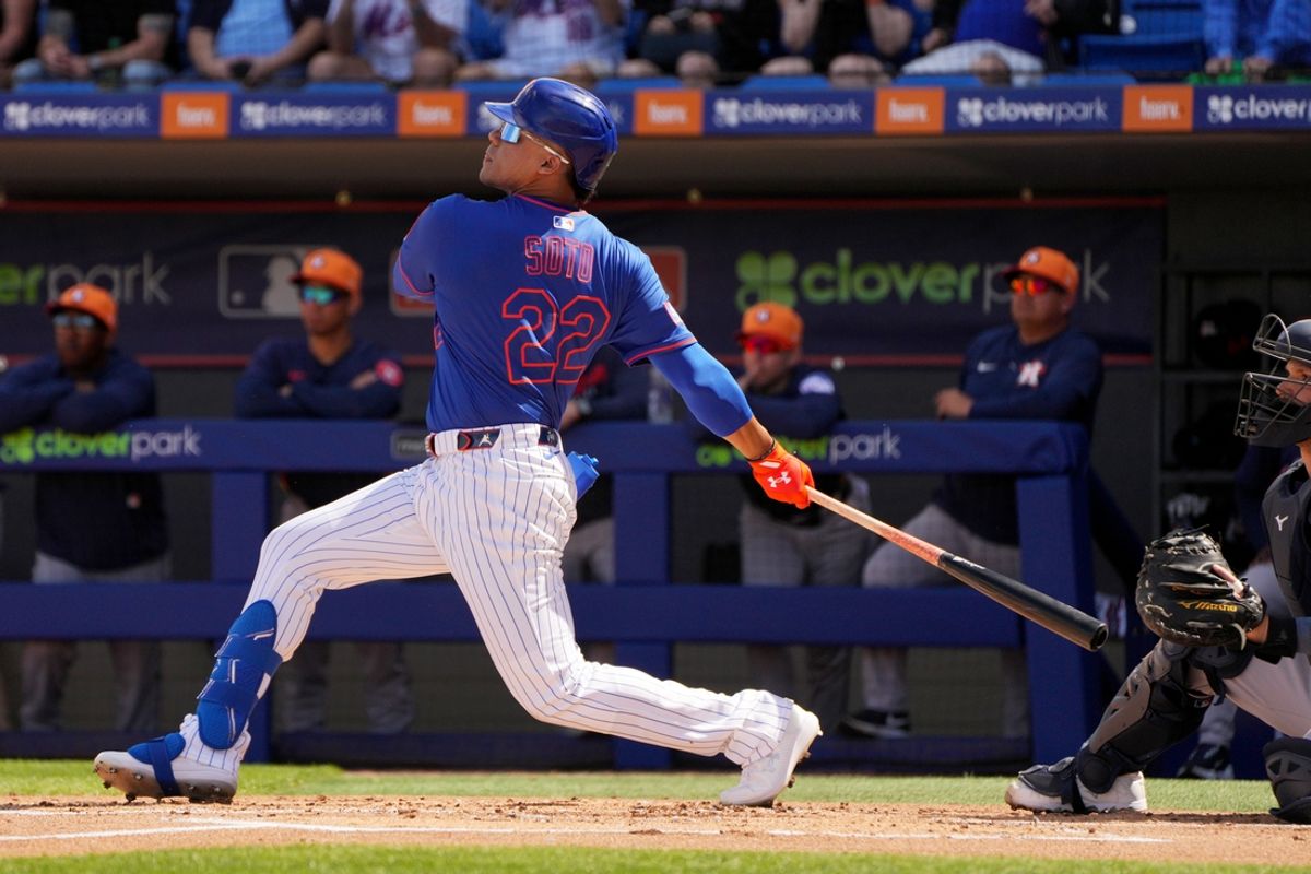 Feb 22, 2025; Port St. Lucie, Florida, USA; New York Mets outfielder Juan Soto (22) hits a home run in his first at bat for the Mets against the Houston Astros in the first inning at Clover Park. Mandatory Credit: Jim Rassol-Imagn Images