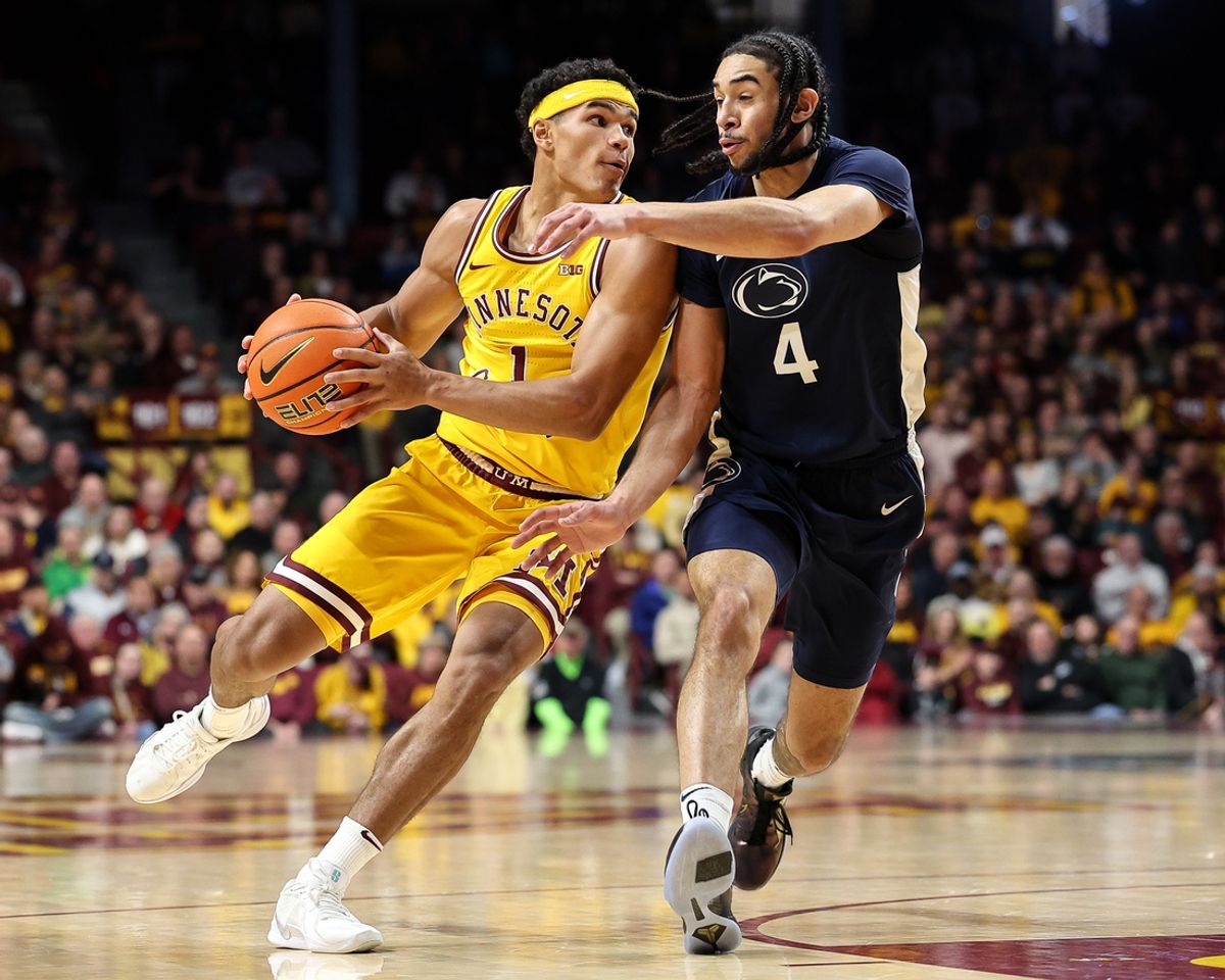 Feb 22, 2025; Minneapolis, Minnesota, USA; Minnesota Golden Gophers guard Isaac Asuma (1) dribbles as Penn State Nittany Lions guard Freddie Dilione V (4) defends during the first half at Williams Arena. Mandatory Credit: Matt Krohn-Imagn Images