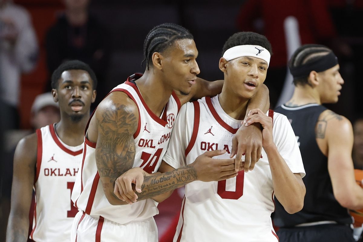 Feb 22, 2025; Norman, Oklahoma, USA; Oklahoma Sooners forward Jalon Moore (14) and guard Jeremiah Fears (0) react after a play against the Mississippi State Bulldogs during the second half at Lloyd Noble Center. Mandatory Credit: Alonzo Adams-Imagn Images