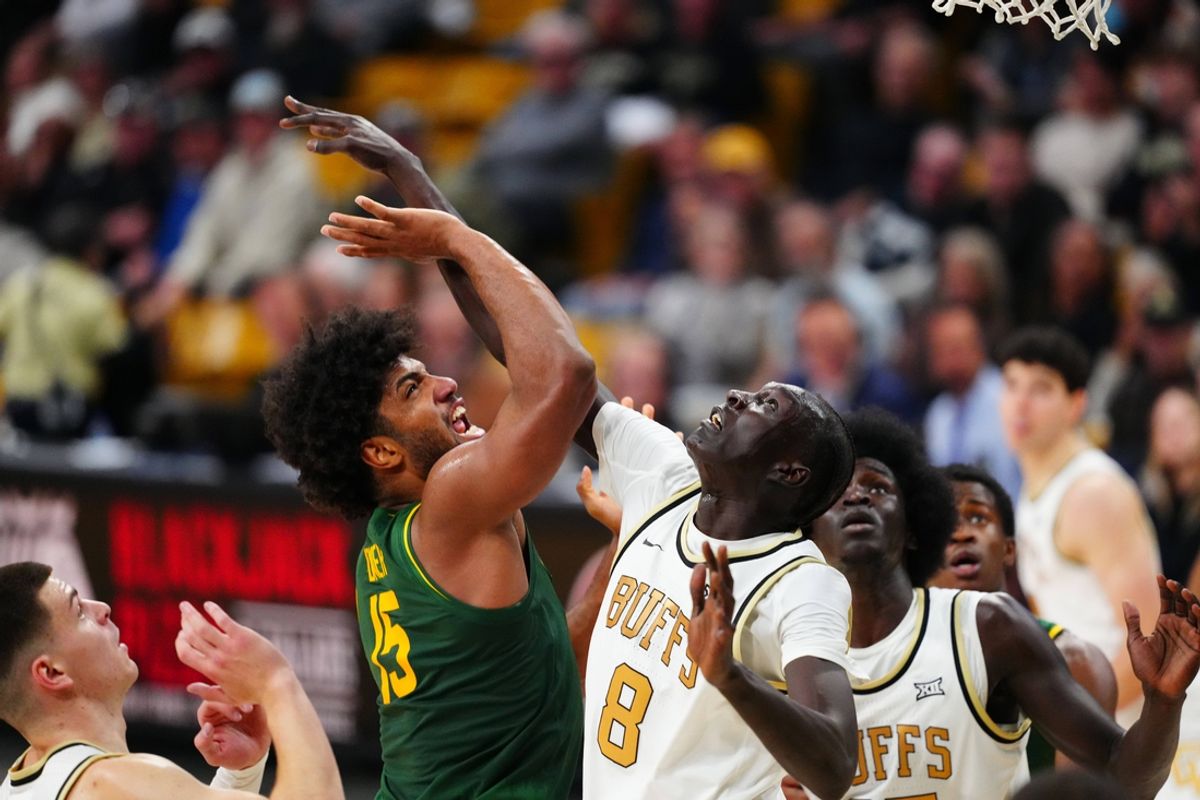 Feb 22, 2025; Boulder, Colorado, USA; Colorado Buffaloes forward Bangot Dak (8) defends on Baylor Bears forward Norchad Omier (15) in the first half at the CU Events Center. Mandatory Credit: Ron Chenoy-Imagn Images