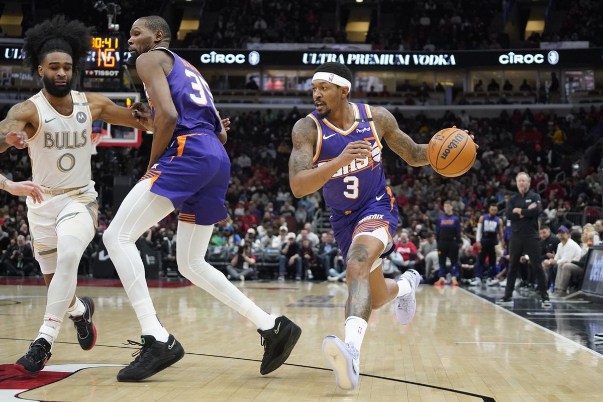 Feb 22, 2025; Chicago, Illinois, USA; Chicago Bulls guard Coby White (0) defends Phoenix Suns guard Bradley Beal (3) during the first quarter at United Center. Mandatory Credit: David Banks-Imagn Images