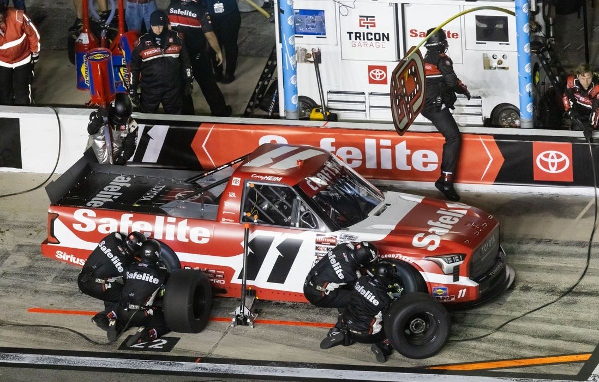 Feb 14, 2025; Daytona Beach, Florida, USA; NASCAR Truck Series driver Corey Heim (11) pits during the Fresh From Florida 250 at Daytona International Speedway. Mandatory Credit: Mark J. Rebilas-Imagn Images