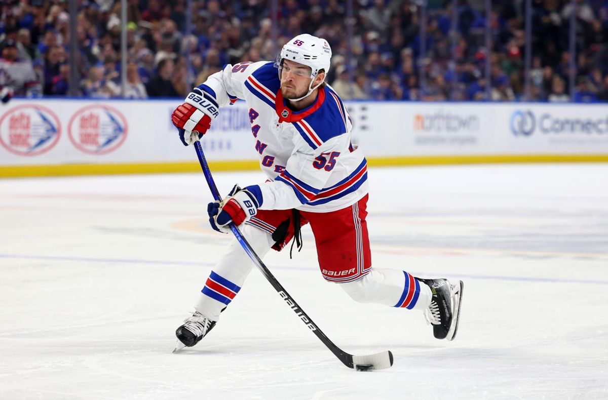 Feb 22, 2025; Buffalo, New York, USA;  New York Rangers defenseman Ryan Lindgren (55) takes a shot on goal during the first period against the Buffalo Sabres at KeyBank Center. Mandatory Credit: Timothy T. Ludwig-Imagn Images