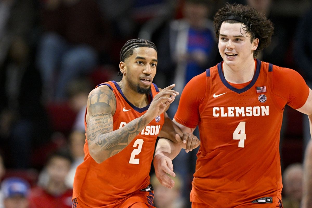 Feb 22, 2025; Dallas, Texas, USA; Clemson Tigers guard Dillon Hunter (2) and forward Ian Schieffelin (4) celebrate during the second half against the SMU Mustangs at Moody Coliseum. Mandatory Credit: Jerome Miron-Imagn Images