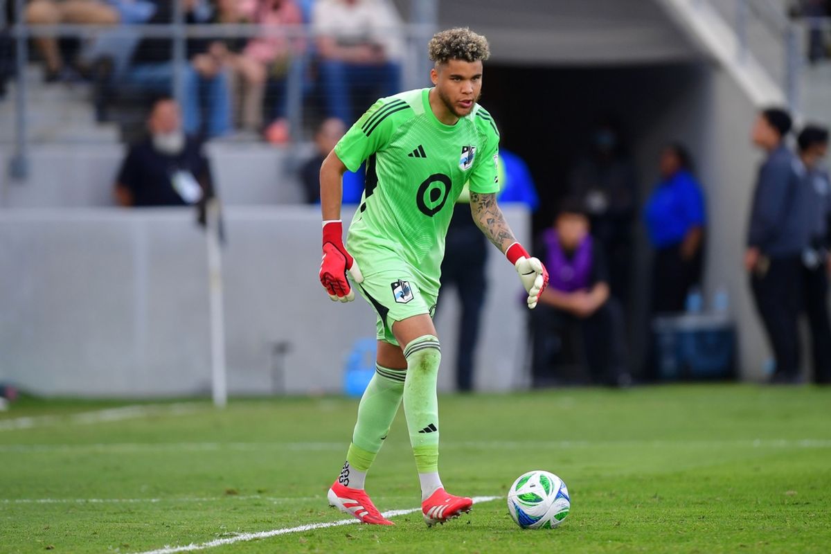 Feb 22, 2025; Los Angeles, California, USA;Minnesota United goalkeeper Dayne St. Clair (97)  kicks the ball against LAFC during the second half at BMO Stadium. Mandatory Credit: Gary A. Vasquez-Imagn Images