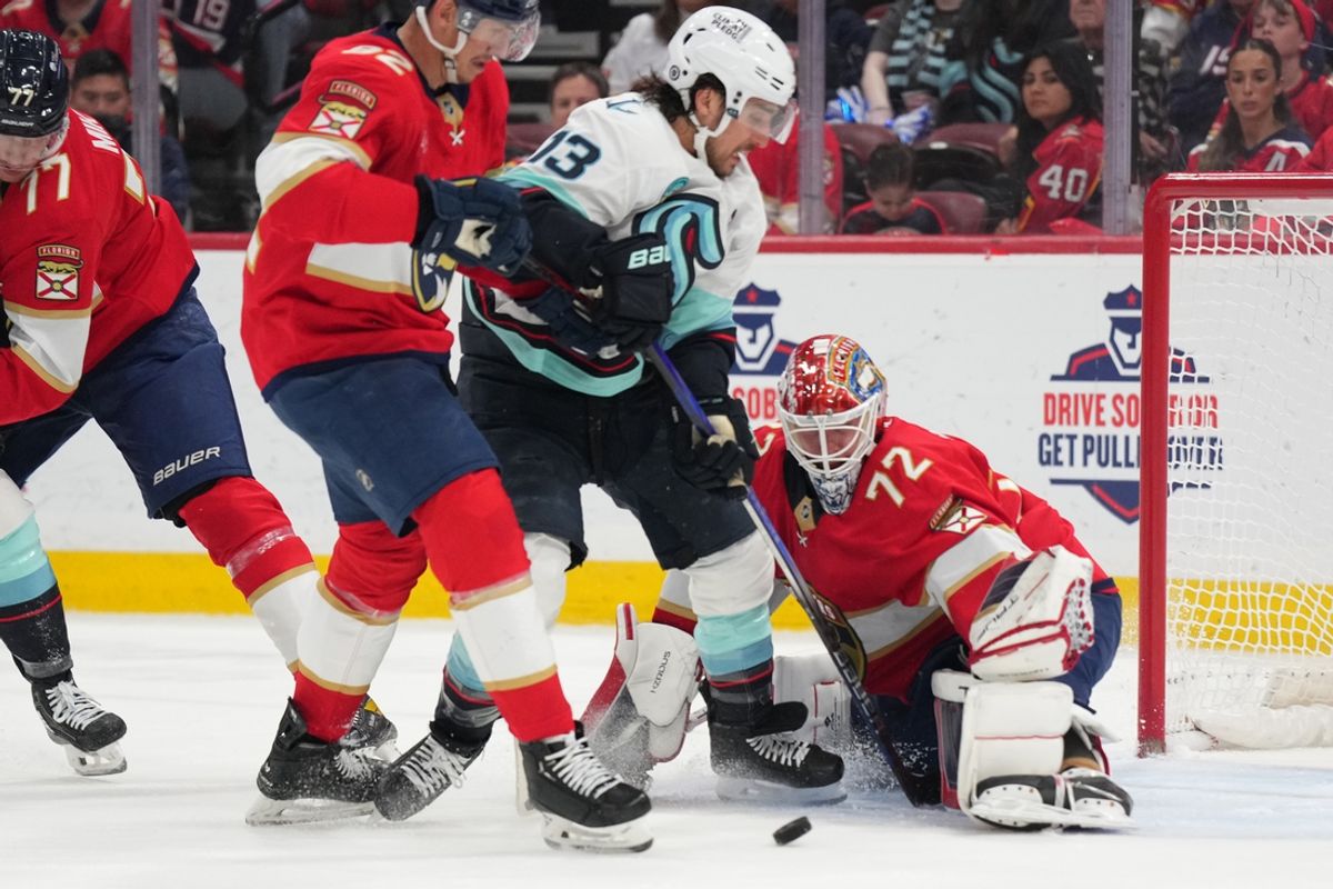 Feb 22, 2025; Sunrise, Florida, USA;  Florida Panthers goaltender Sergei Bobrovsky (72) makes a save on Seattle Kraken left wing Brandon Tanev (13) in the first period at Amerant Bank Arena. Mandatory Credit: Jim Rassol-Imagn Images