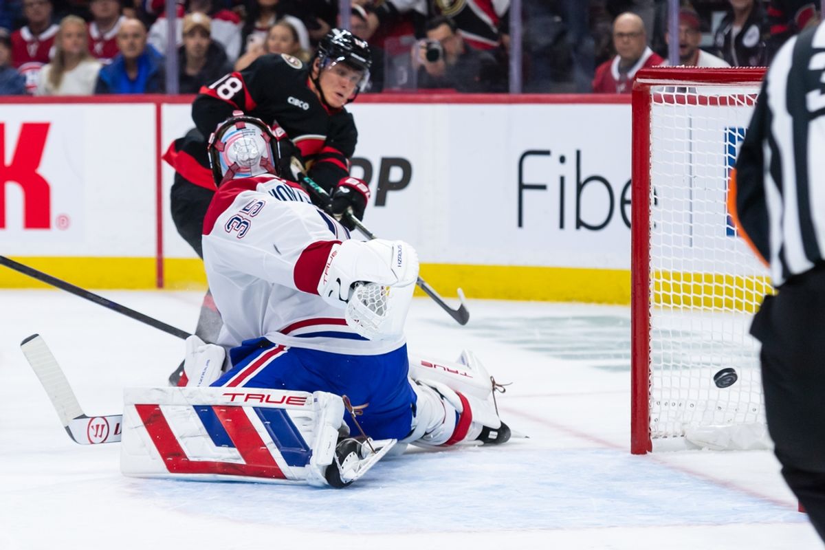 Feb 22, 2025; Ottawa, Ontario, CAN; Ottawa Senators center Tim Stutzle (18) scores against Montreal Canadiens goalie Sam Montembeault (35) in the first period at the Canadian Tire Centre. Mandatory Credit: Marc DesRosiers-Imagn Images