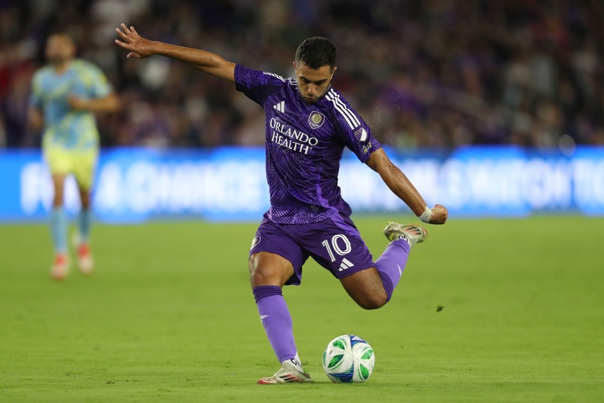Feb 22, 2025; Orlando, Florida, USA; Orlando City midfielder Martin Ojeda (10) kicks the ball against the Philadelphia Union in the first half at Inter&Co Stadium. Mandatory Credit: Morgan Tencza-Imagn Images