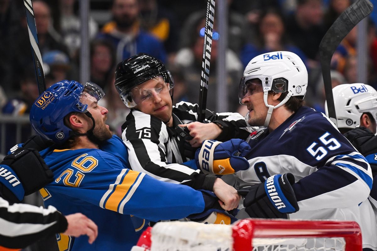 Feb 22, 2025; St. Louis, Missouri, USA; St. Louis Blues left wing Nathan Walker (26) and Winnipeg Jets center Mark Scheifele (55) get physical during the second period at Enterprise Center. Mandatory Credit: Connor Hamilton-Imagn Images