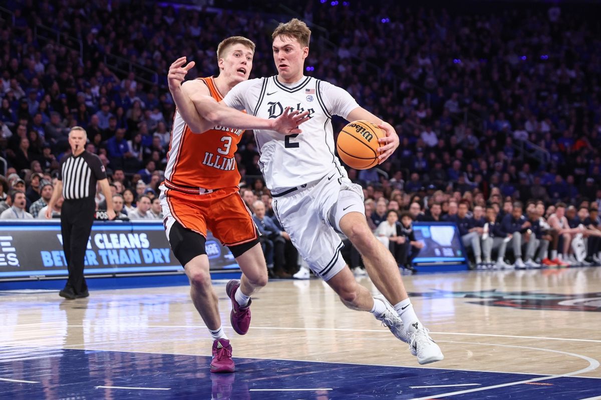Feb 22, 2025; New York, NY, USA;  Duke Blue Devils guard Cooper Flagg (2) drives past Illinois Fighting Illini forward Ben Humrichous (3) in the first half at Madison Square Garden. Mandatory Credit: Wendell Cruz-Imagn Images