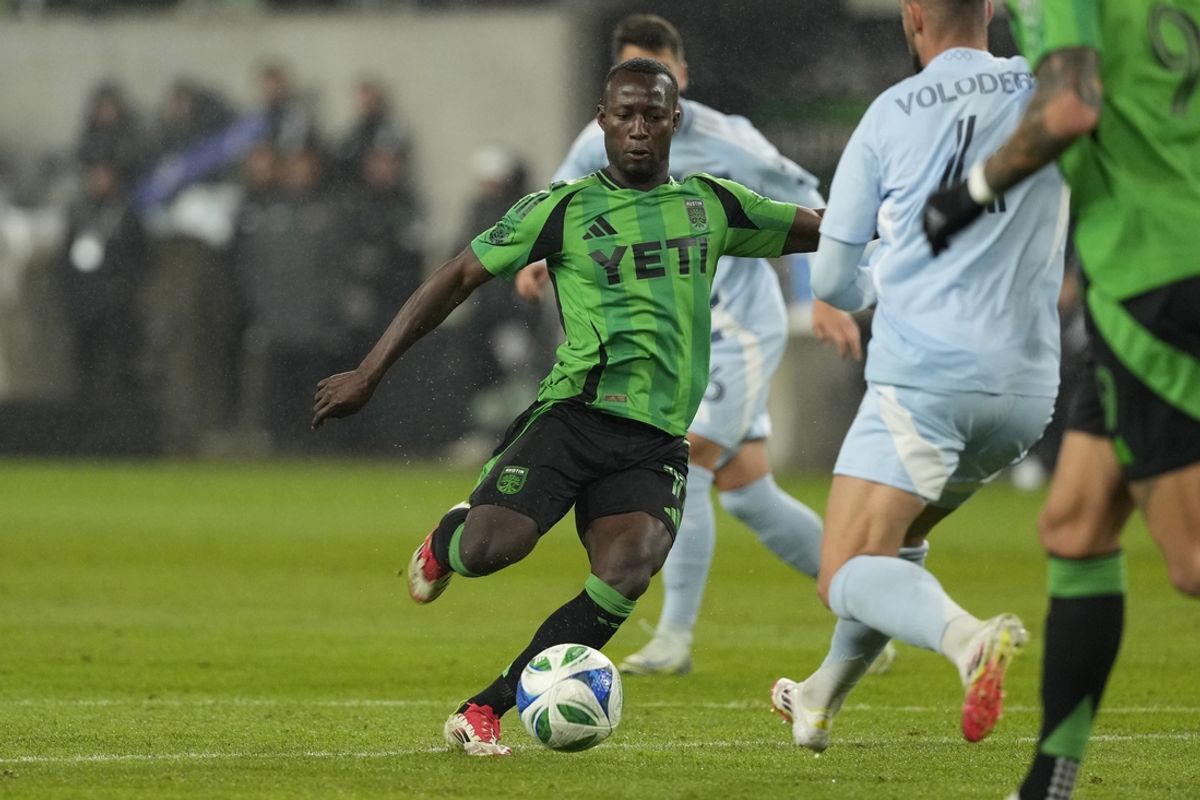 Feb 22, 2025; Austin, Texas, USA; Austin FC forward Osman Bukari (11) shoots on goal during the first half against Sporting Kansas City at Q2 Stadium. Mandatory Credit: Scott Wachter-Imagn Images