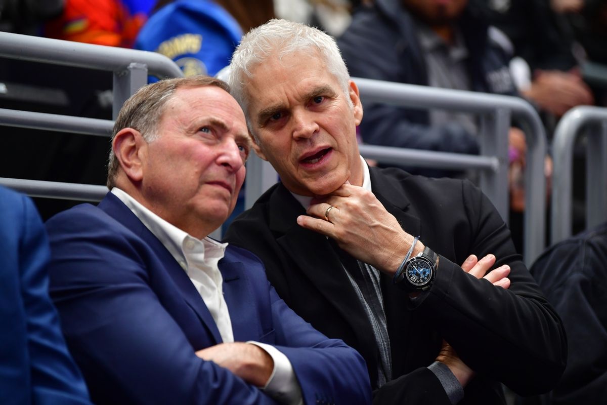 Feb 22, 2025; Los Angeles, California, USA; Los Angeles Kings executive Luc Robitaille with commissioner Gary Bettman during the first period at Crypto.com Arena. Mandatory Credit: Gary A. Vasquez-Imagn Images