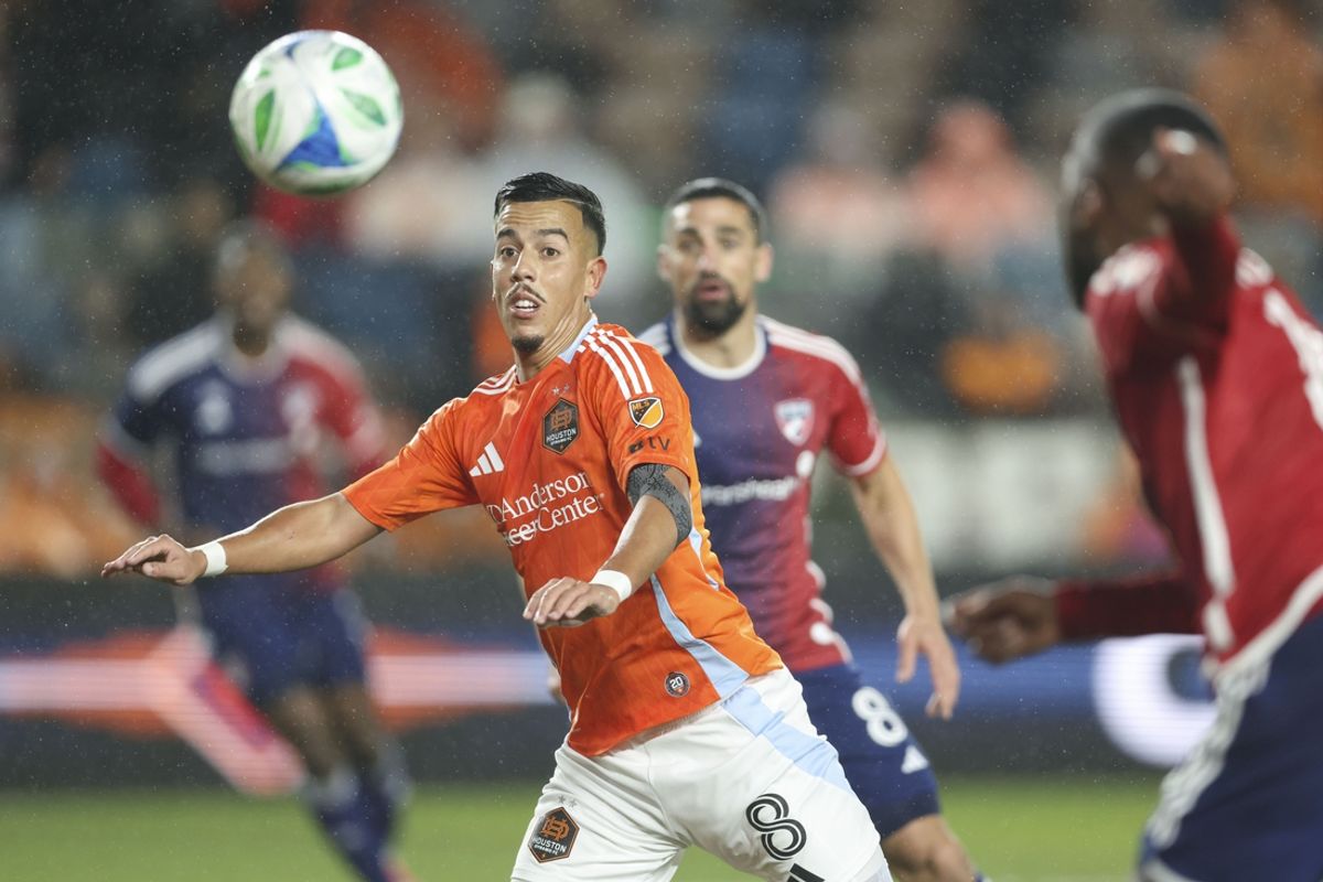 Feb 22, 2025; Houston, Texas, USA; Houston Dynamo FC midfielder Amine Bassi (8) focuses on the ball during the first half against FC Dallas at Shell Energy Stadium. Mandatory Credit: Troy Taormina-Imagn Images