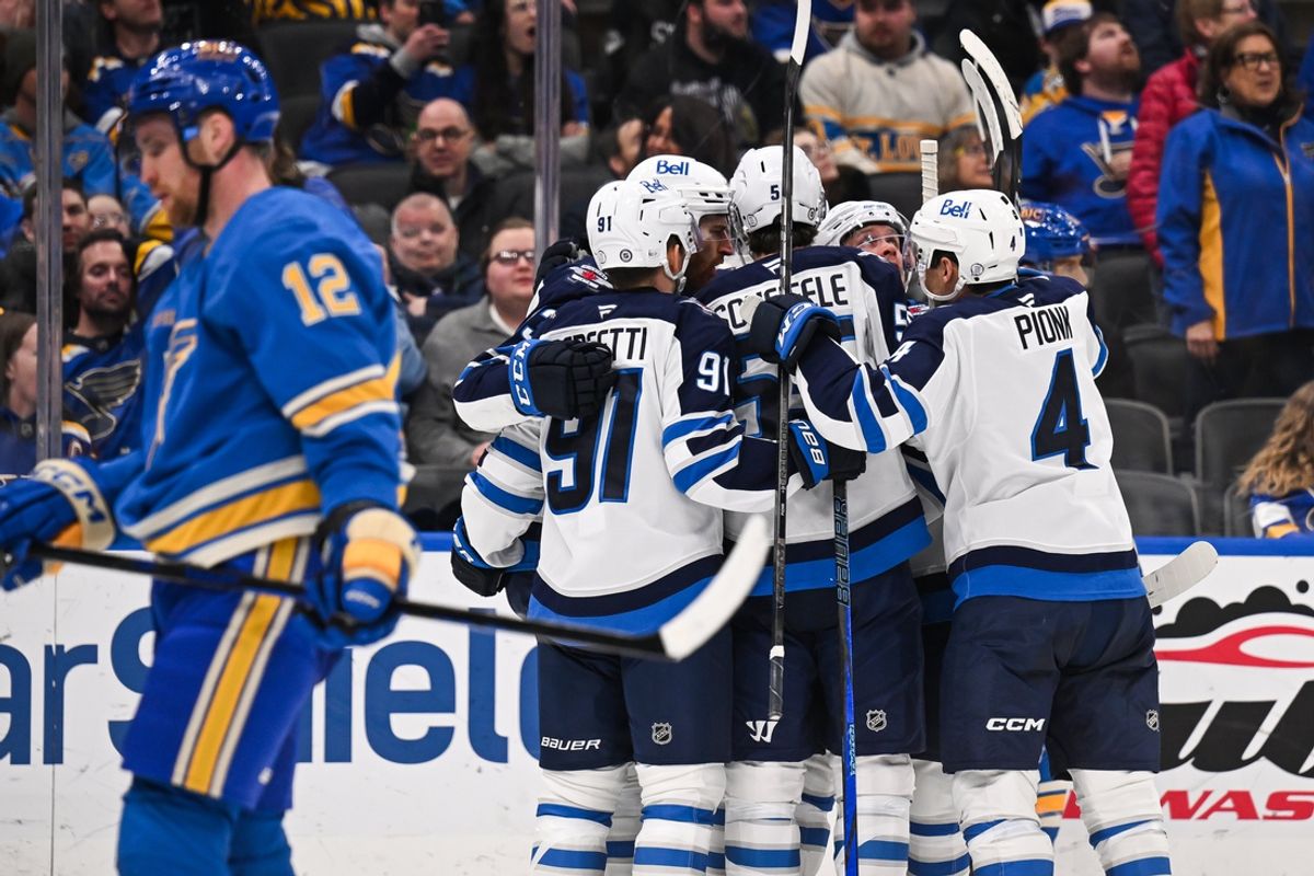 Feb 22, 2025; St. Louis, Missouri, USA; Winnipeg Jets center Gabriel Vilardi (13) celebrates with teammates after scoring agains the St. Louis Blues during the third period at Enterprise Center. Mandatory Credit: Connor Hamilton-Imagn Images